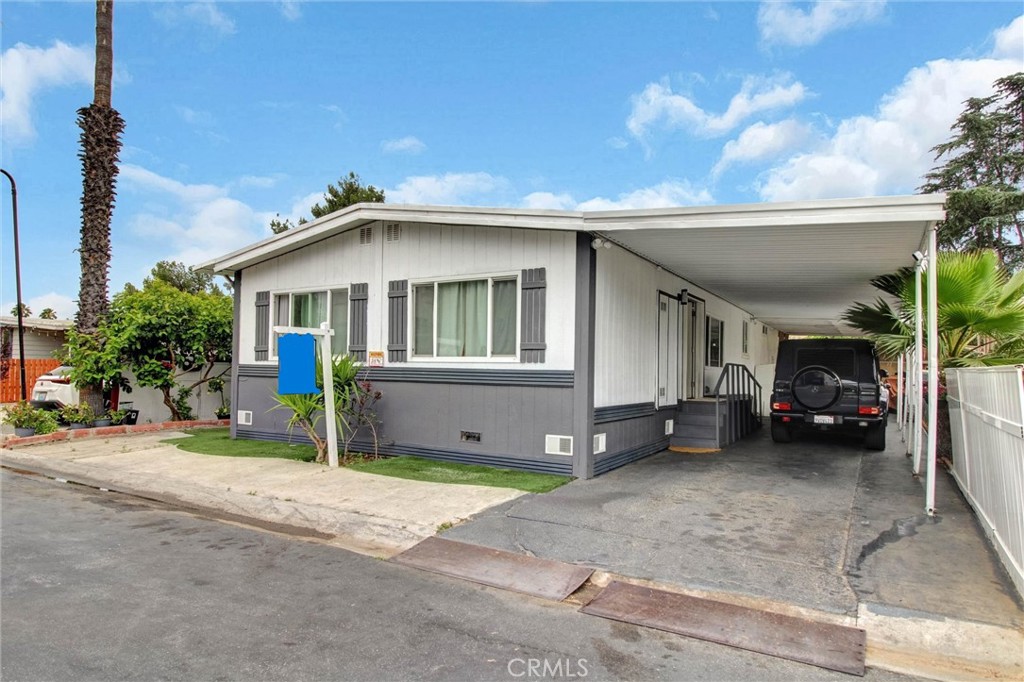 1025 South Riverside Avenue, Unit 26 Rialto, CA 92376 - Photo 3 of 27 a house view with a outdoor space
