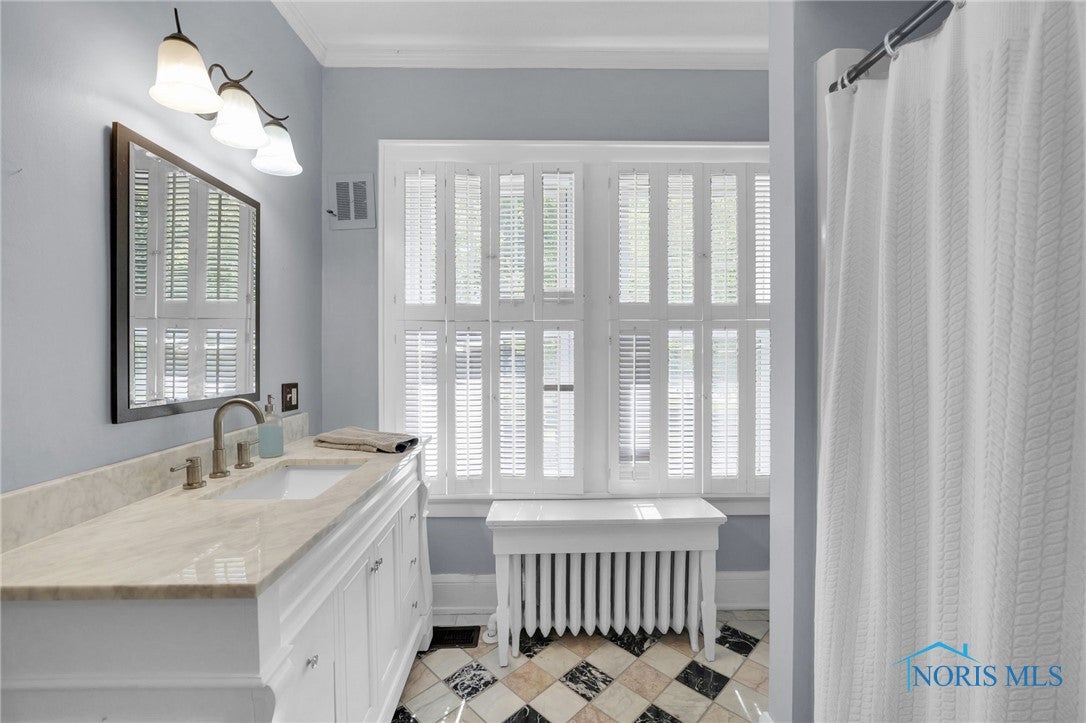 369 Colony Road Rossford, OH 43460 - Photo 14 of 37 This first floor full bath has a new vanity and a walk-in shower.