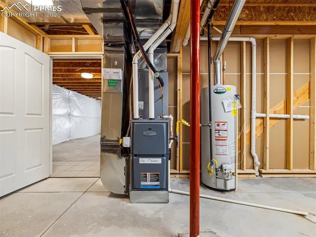 a view of a kitchen with kitchen island a sink stainless steel appliances and cabinets