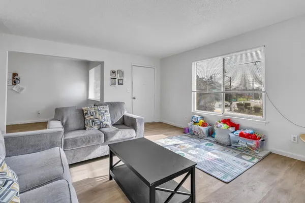 a kitchen with a sink stove and a refrigerator