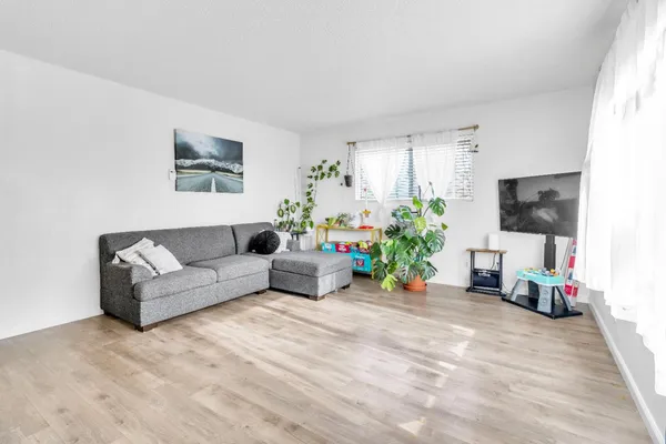 a kitchen with stainless steel appliances a sink stove and refrigerator