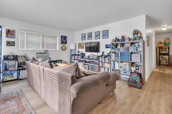 a kitchen with stainless steel appliances a stove a sink a refrigerator and a cabinets