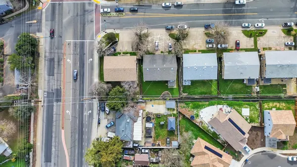 an aerial view of a house with outdoor space
