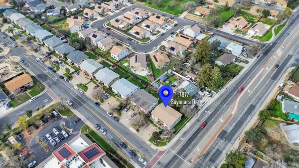 a view of a backyard with a fence