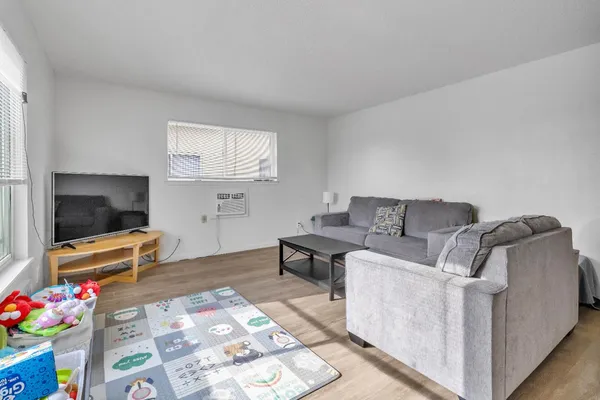 a living room with furniture and a table