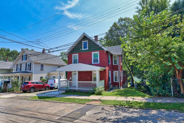 a front view of a house with a yard