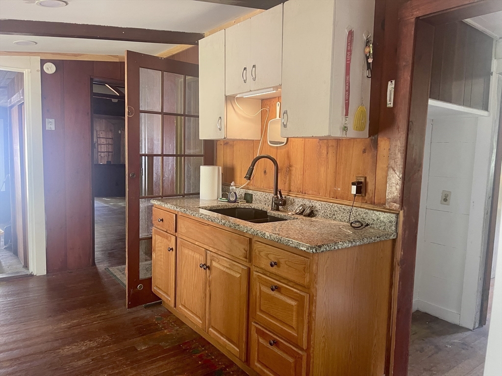 32 Hollow Road Wales, MA 01081 - Photo 8 of 35 a kitchen with stainless steel appliances granite countertop a sink and a refrigerator