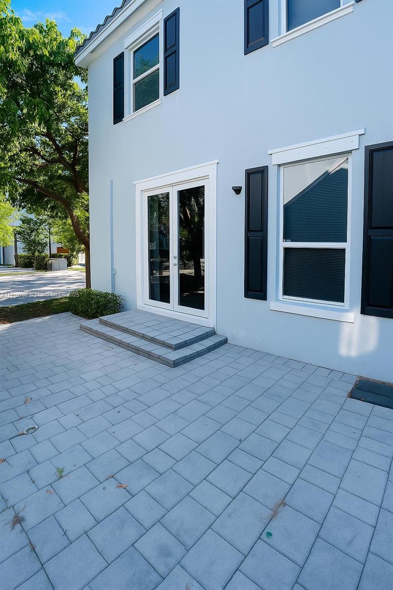 9253 Southwest 169th Avenue Miami, FL 33196 - Photo 2 of 3 a view of yellow house with a yard