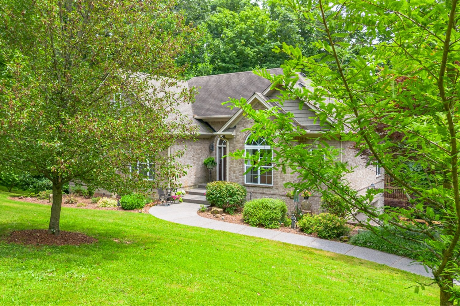 1765 Sugar Ridge Road Spring Hill, TN 37174 - Photo 38 of 44 a backyard of a house with lots of green space and fountain