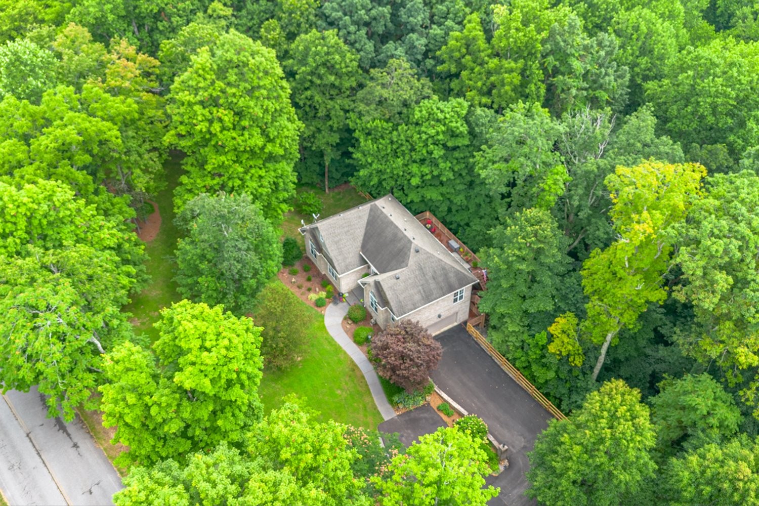 1765 Sugar Ridge Road Spring Hill, TN 37174 - Photo 42 of 44 an aerial view of a house with a yard and garden