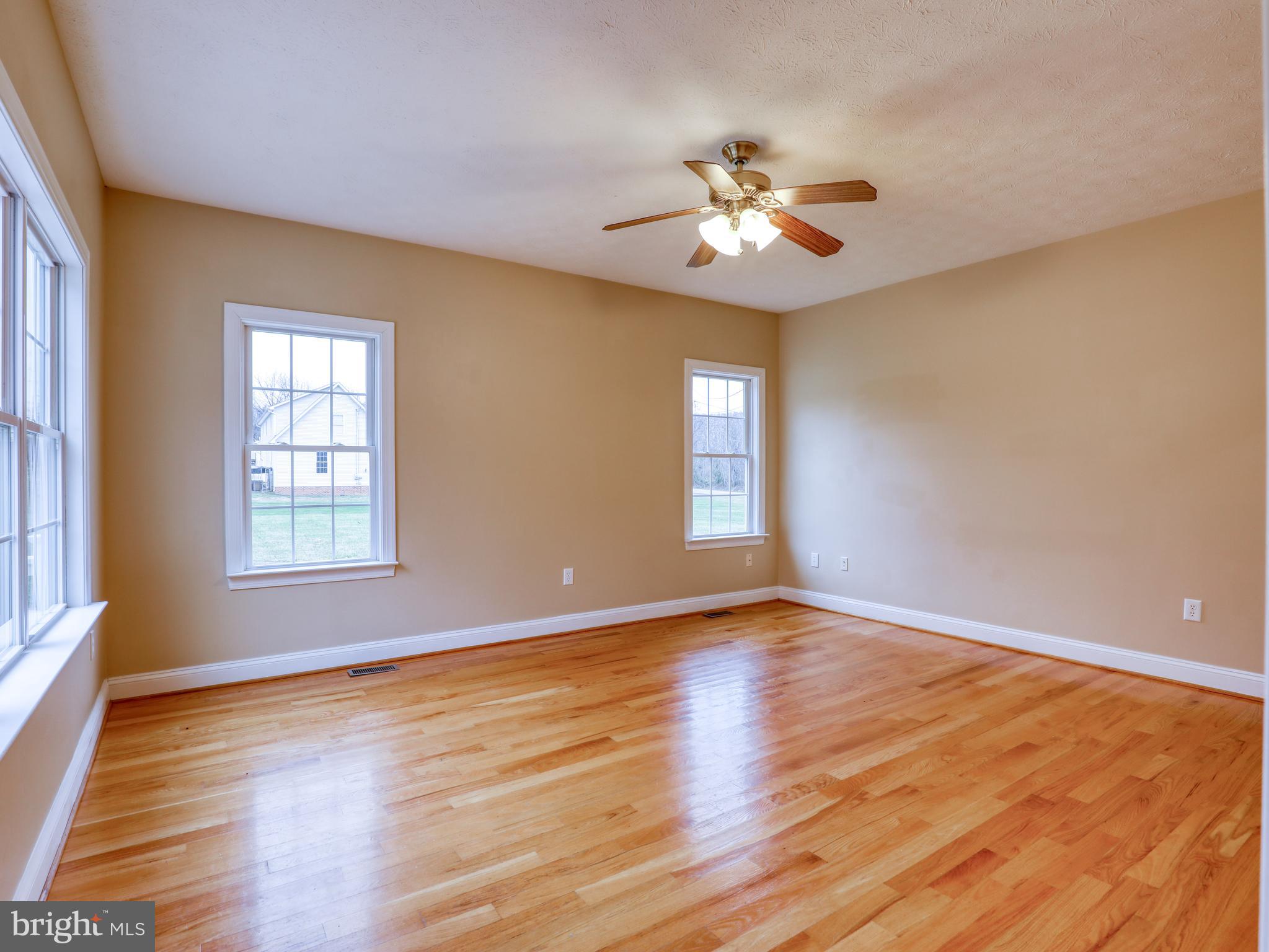 2333 Dominion Road Gerrardstown, WV 25420 - Photo 14 of 36 Family room has fresh paint and hardwood floors