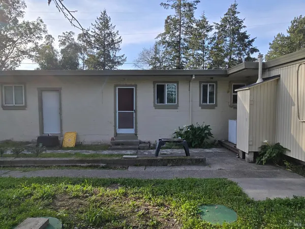 a house view with a backyard space