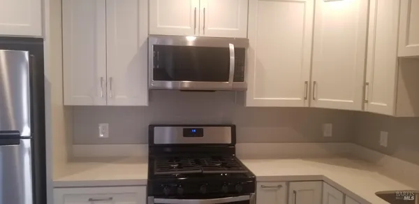 a bathroom with a toilet sink and a window