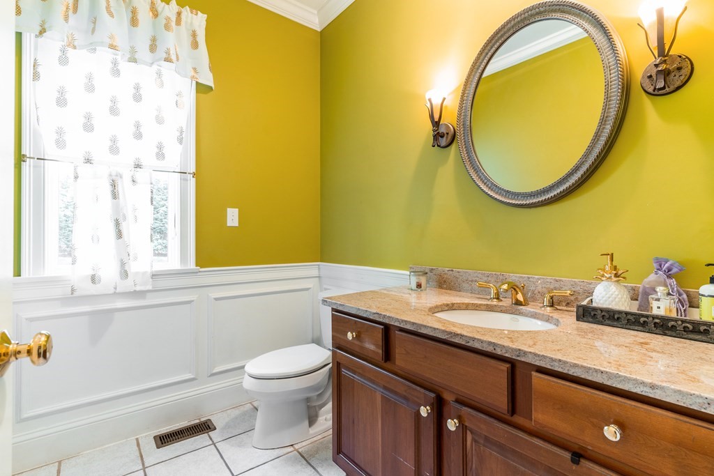 139 Shade Street Lexington, MA 02421 - Photo 18 of 42 a bathroom with a sink and a mirror