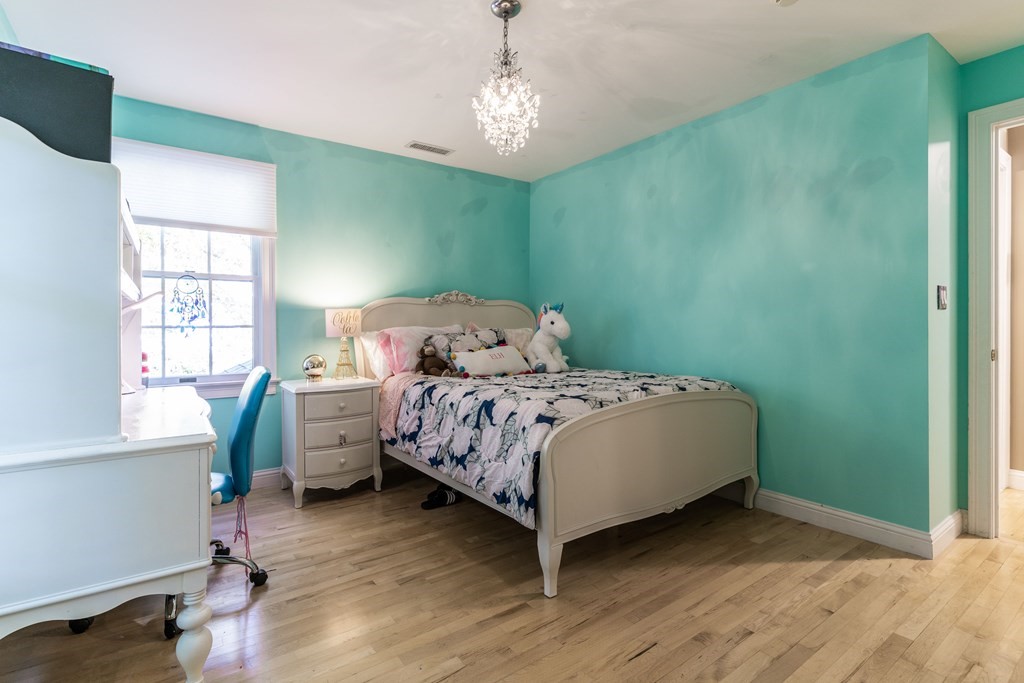 139 Shade Street Lexington, MA 02421 - Photo 27 of 42 a bedroom with a bed and a window