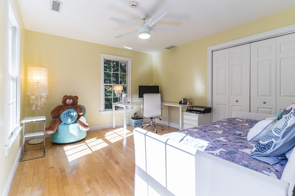 139 Shade Street Lexington, MA 02421 - Photo 28 of 42 a living room with furniture and a flat screen tv