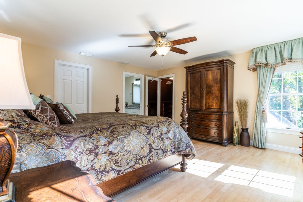 139 Shade Street Lexington, MA 02421 - Photo 29 of 42 a bedroom with a bed and a walk in closet