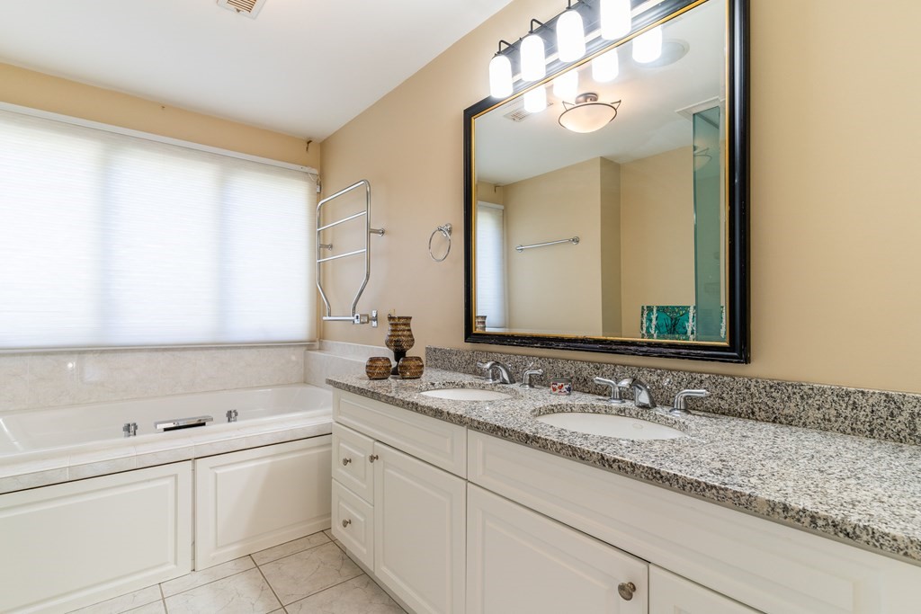 139 Shade Street Lexington, MA 02421 - Photo 32 of 42 a bathroom with a sink and a mirror