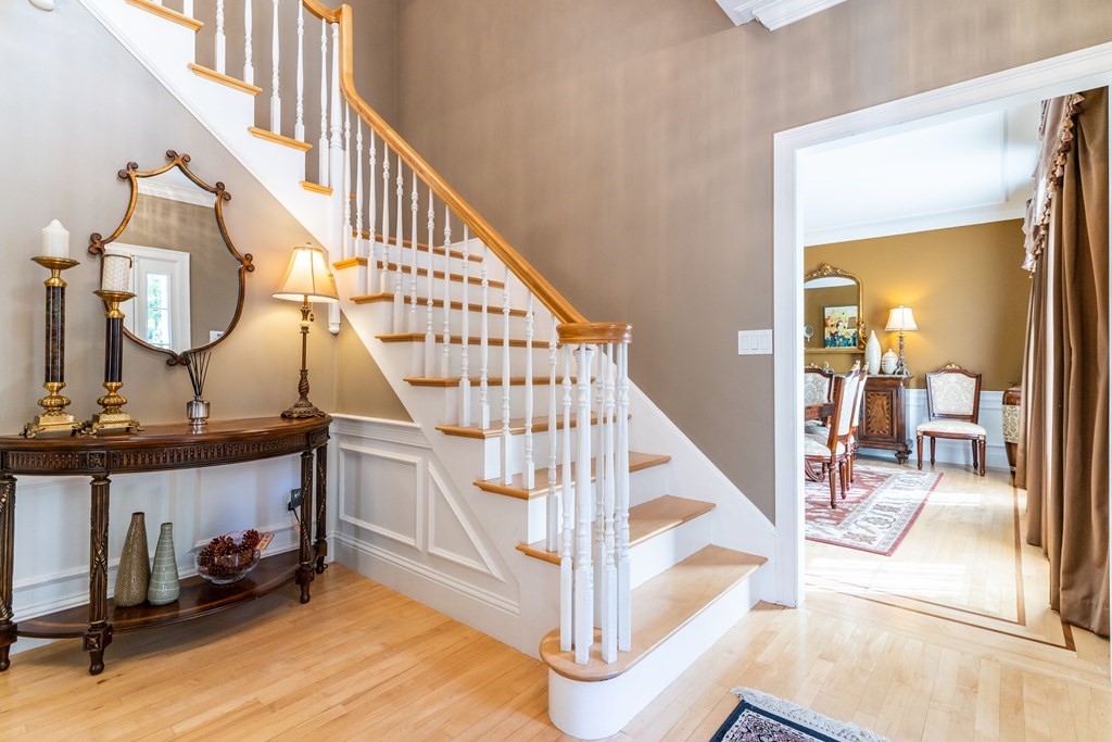 139 Shade Street Lexington, MA 02421 - Photo 5 of 42 a view of entryway and hall with wooden floor