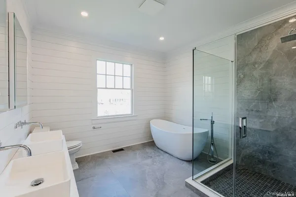 a bathroom with a bathtub and shower