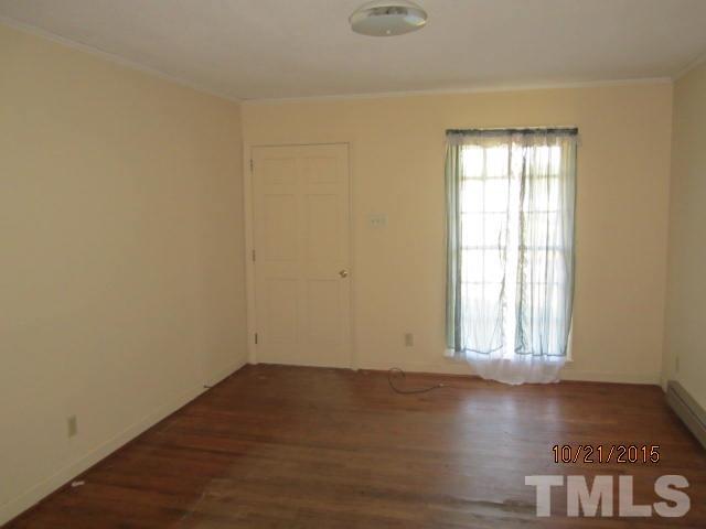 2250 Bobbitt Road Kittrell, NC 27544 - Photo 6 of 15 an empty room with wooden floor and windows