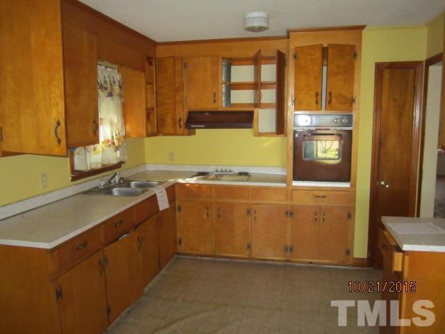 2250 Bobbitt Road Kittrell, NC 27544 - Photo 7 of 15 a view of a kitchen with a sink and a refrigerator