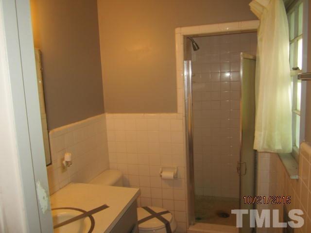2250 Bobbitt Road Kittrell, NC 27544 - Photo 10 of 15 a bathroom with a granite countertop sink and a mirror