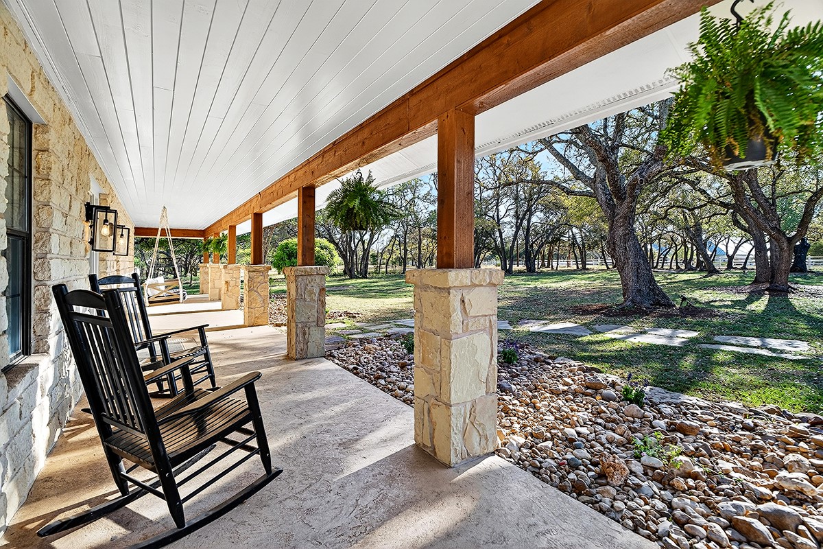 301 Medlin Creek Loop Dripping Springs, TX 78620 - Photo 27 of 40 Front porch featuring a yard