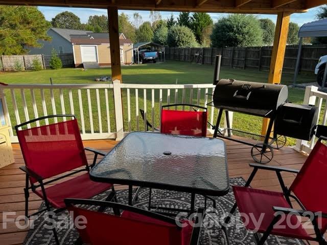 628 Champion Ferry Road Gaffney, SC 29341 - Photo 24 of 26 a view of a chairs and table in the patio