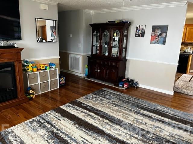 628 Champion Ferry Road Gaffney, SC 29341 - Photo 5 of 26 a room with wooden floor and a fireplace