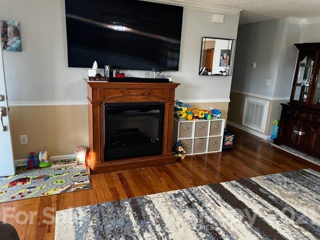 628 Champion Ferry Road Gaffney, SC 29341 - Photo 6 of 26 a living room with furniture a flat screen tv and a fireplace