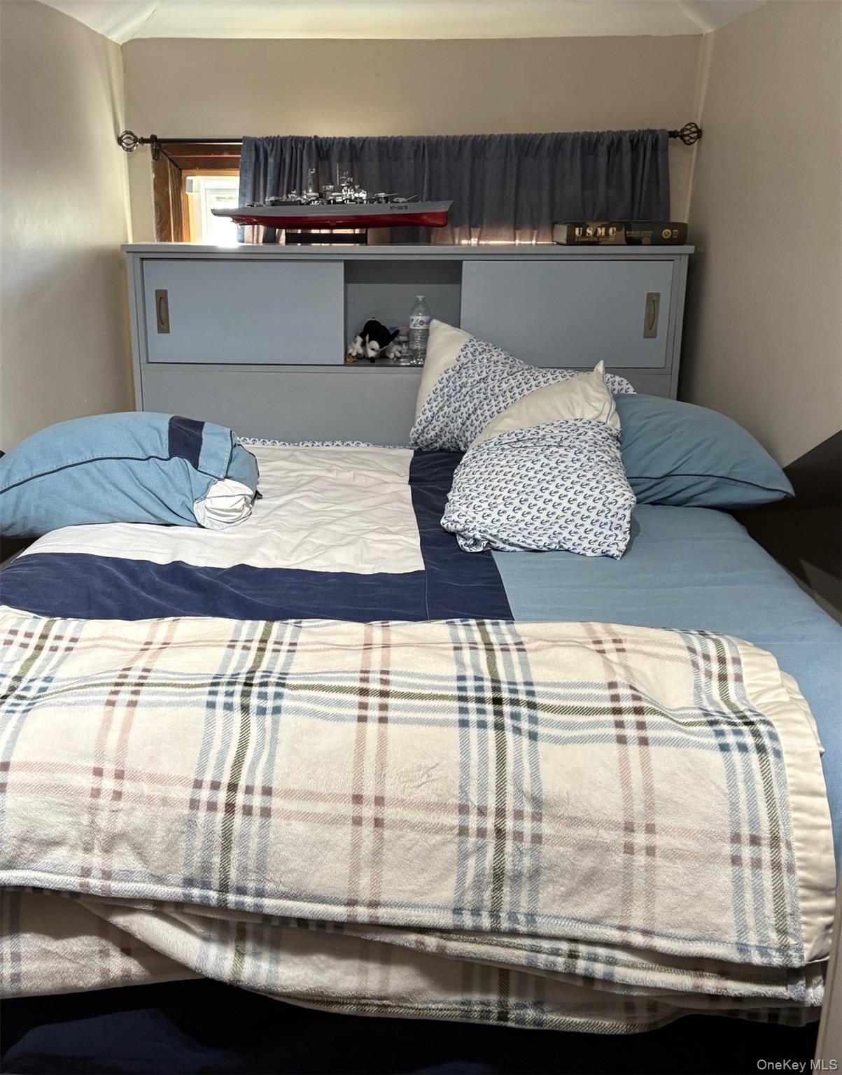 140-99 Burden Crescent, Unit 2 Queens, NY 11435 - Photo 4 of 8 a living room with a table and kitchen view