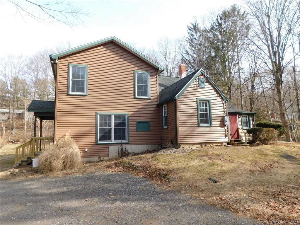 a view of a house with a yard and garage
