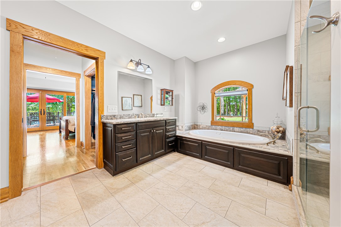 285 Bertha Allen Road Westminster, SC 29693 - Photo 19 of 50 Indulge in a tranquil bathing experience with a soaking tub and generous vanity.