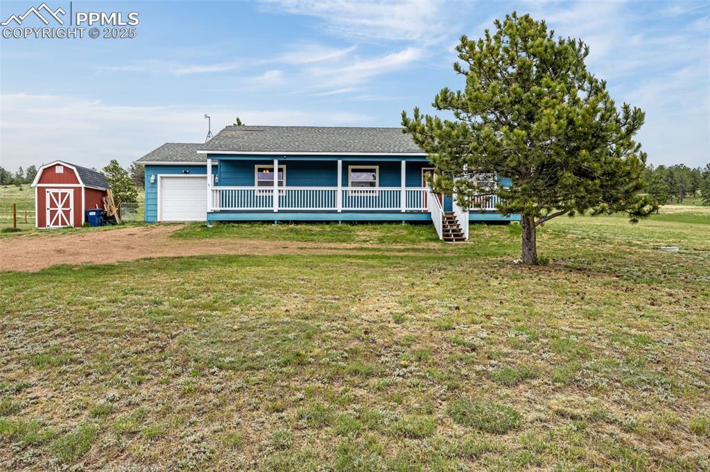 406 High Pasture Road Florissant, CO 80816 - Photo 1 of 28 a view of a house with a yard