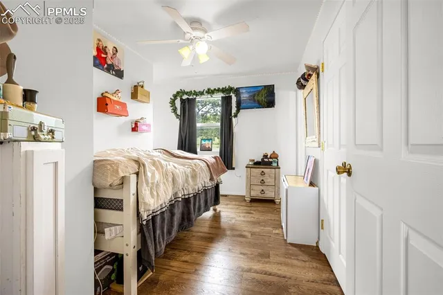 a bedroom with bed and a window