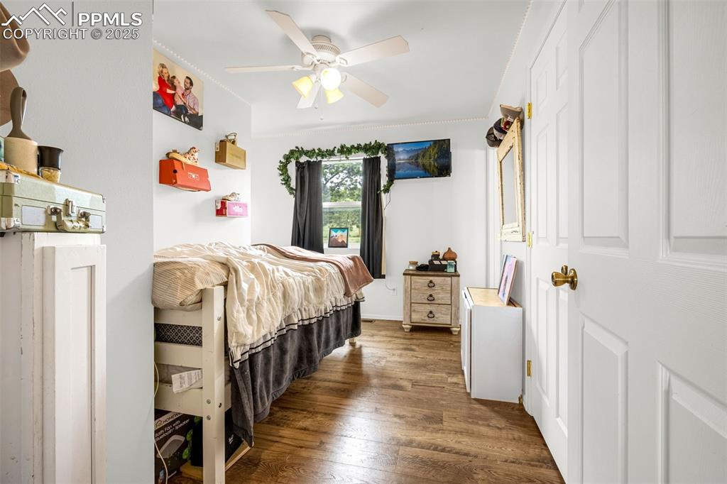 406 High Pasture Road Florissant, CO 80816 - Photo 12 of 28 a bedroom with bed and a window