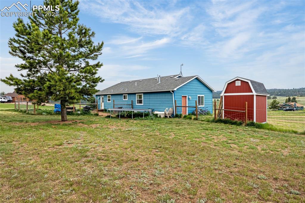 406 High Pasture Road Florissant, CO 80816 - Photo 16 of 28 a front view of a house with garden