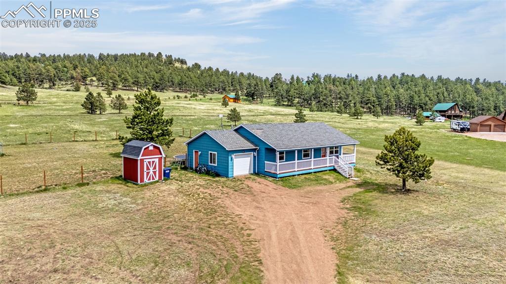 406 High Pasture Road Florissant, CO 80816 - Photo 20 of 28 a view of a house with a ocean view