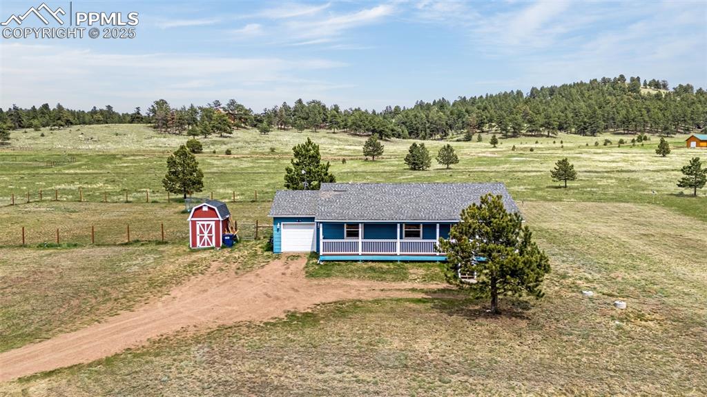 406 High Pasture Road Florissant, CO 80816 - Photo 21 of 28 a view of a house with a lake view