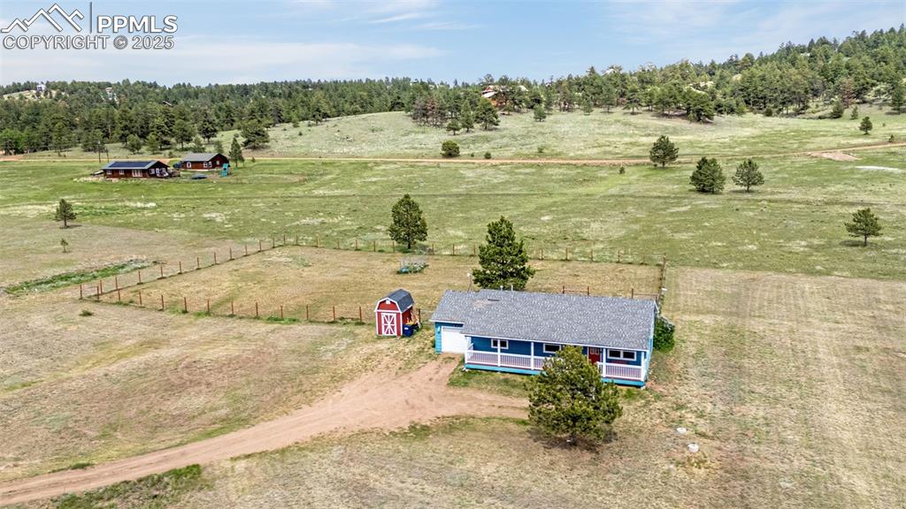 406 High Pasture Road Florissant, CO 80816 - Photo 22 of 28 a view of a lake with an ocean beach