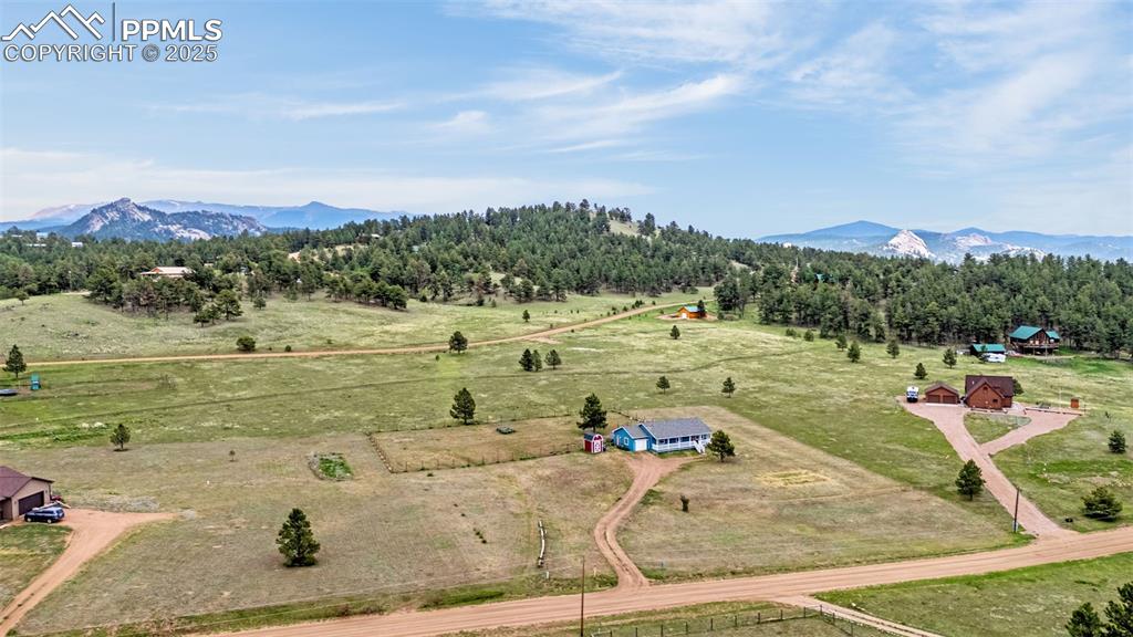 406 High Pasture Road Florissant, CO 80816 - Photo 26 of 28 a view of a swimming pool with a yard