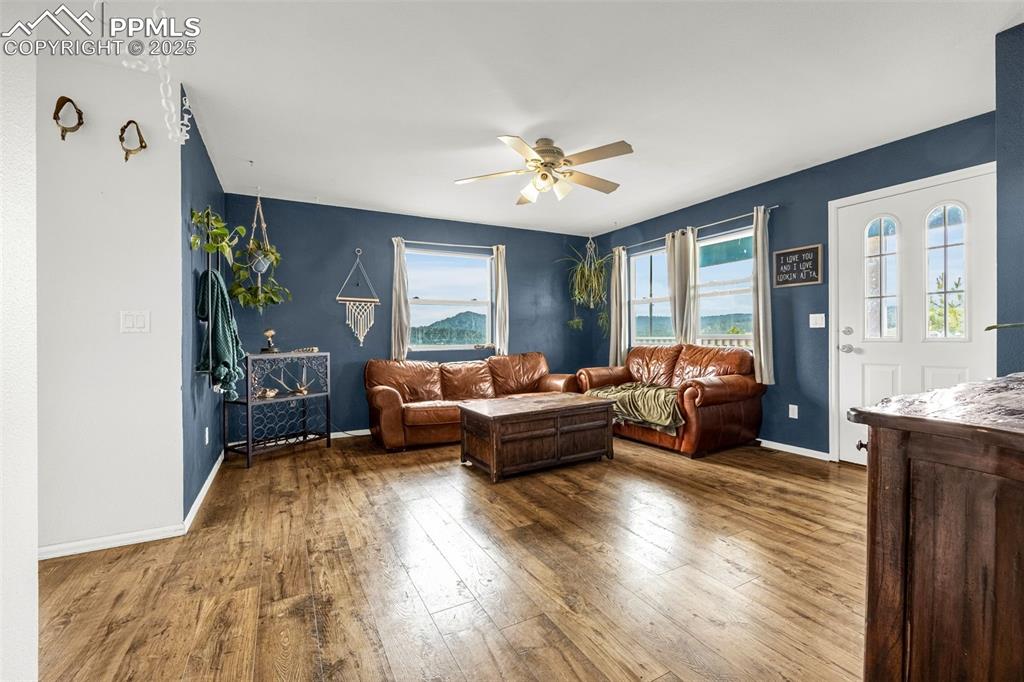 406 High Pasture Road Florissant, CO 80816 - Photo 4 of 28 a living room with furniture and a large window