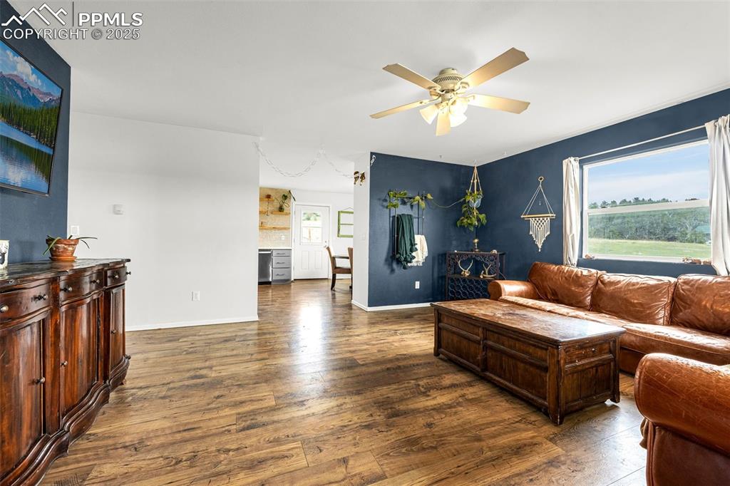 406 High Pasture Road Florissant, CO 80816 - Photo 5 of 28 a living room with furniture and a large window