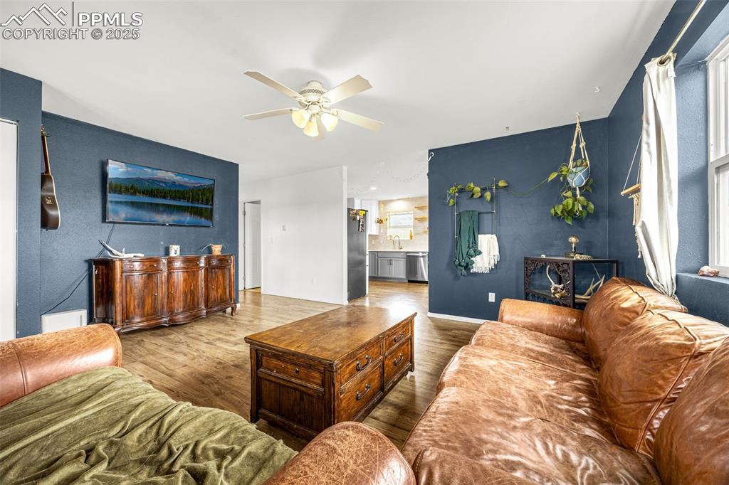 406 High Pasture Road Florissant, CO 80816 - Photo 6 of 28 a bedroom with a bed and a chandelier