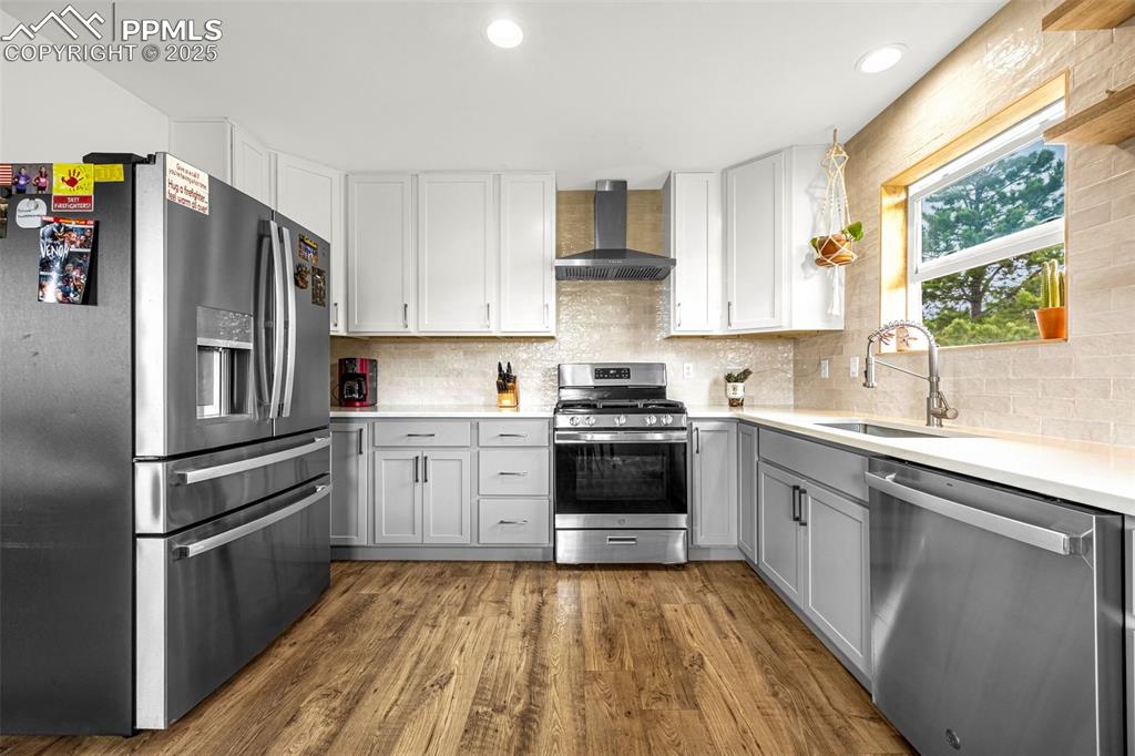 406 High Pasture Road Florissant, CO 80816 - Photo 7 of 28 a kitchen with a sink appliances and cabinets