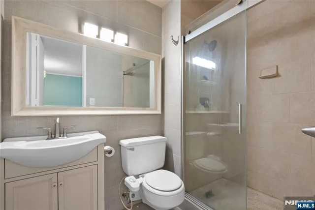 a living room with furniture and large windows