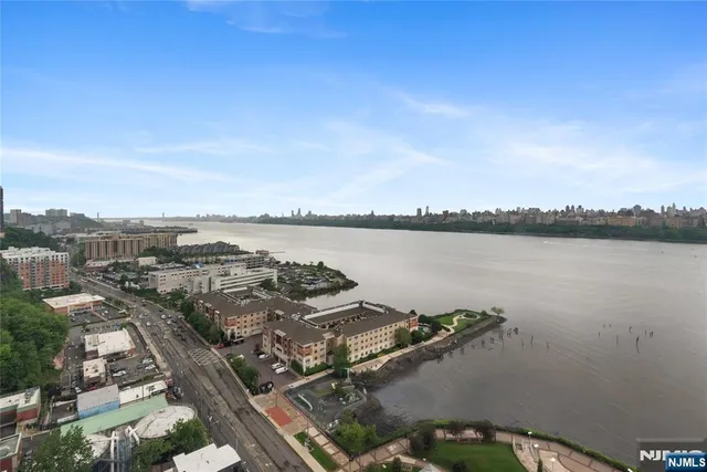 a kitchen with a stove and a white cabinet