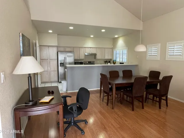 a view of a dining room with furniture and wooden floor