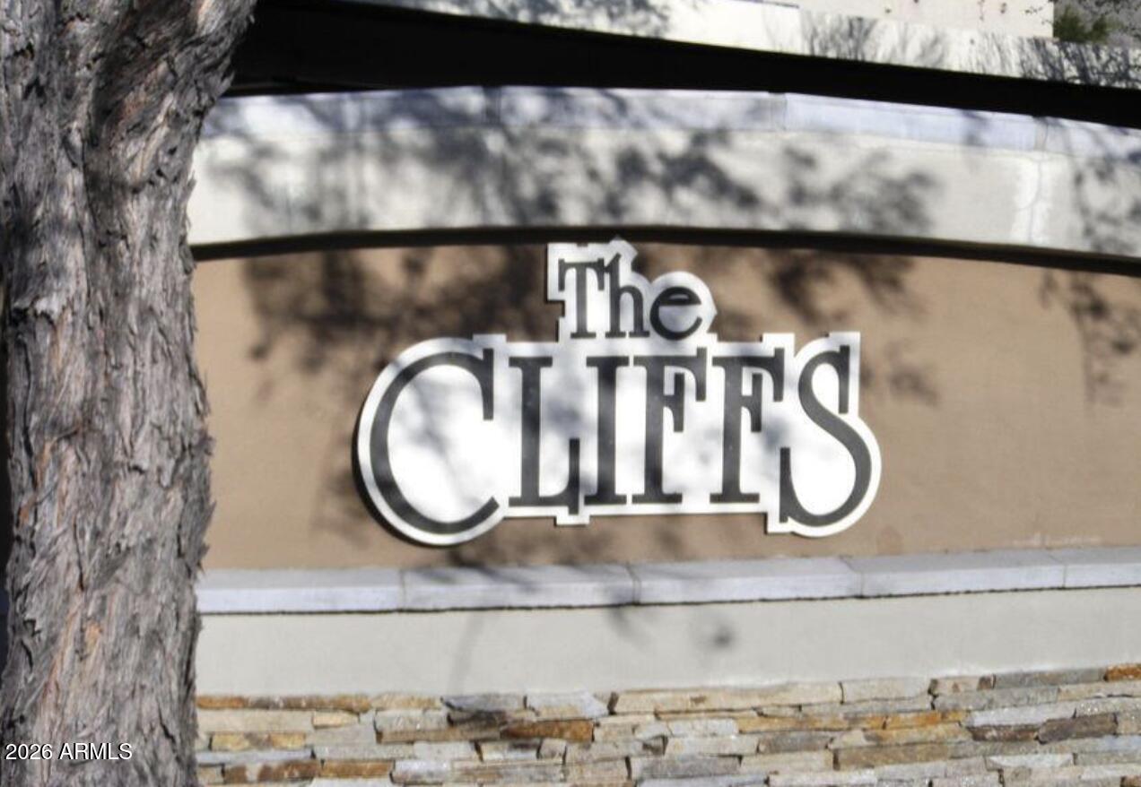 1720 East Thunderbird Road, Unit 1100 Phoenix, AZ 85022 - Photo 33 of 34 a bathroom with a mirror and a wooden floor